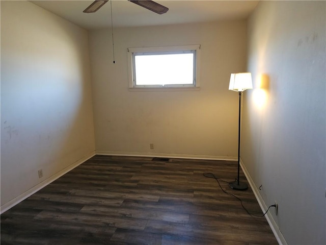 unfurnished room with ceiling fan, baseboards, and wood finished floors