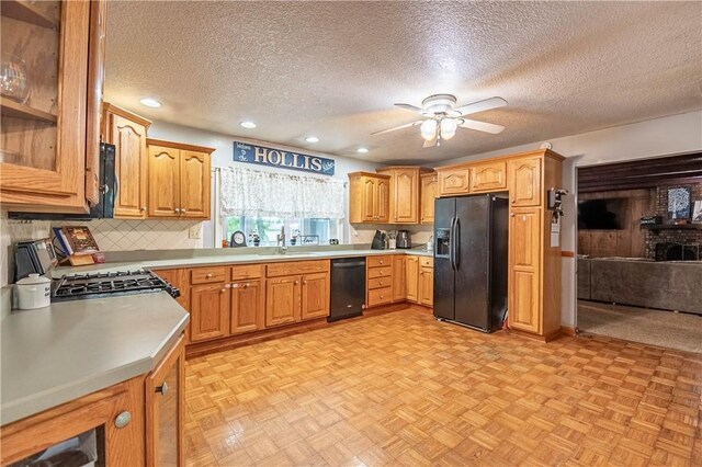 685 E Main St, Warrensburg, IL 62573 - kitchen featuring black appliances, a textured ceiling, ceiling fan, light countertops, and recessed lighting