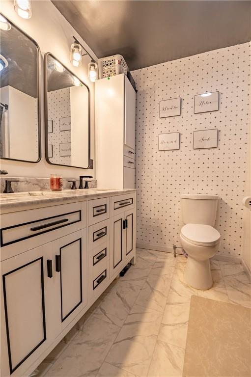 685 E Main St, Warrensburg, IL 62573 - bathroom with marble look tile flooring and double vanity