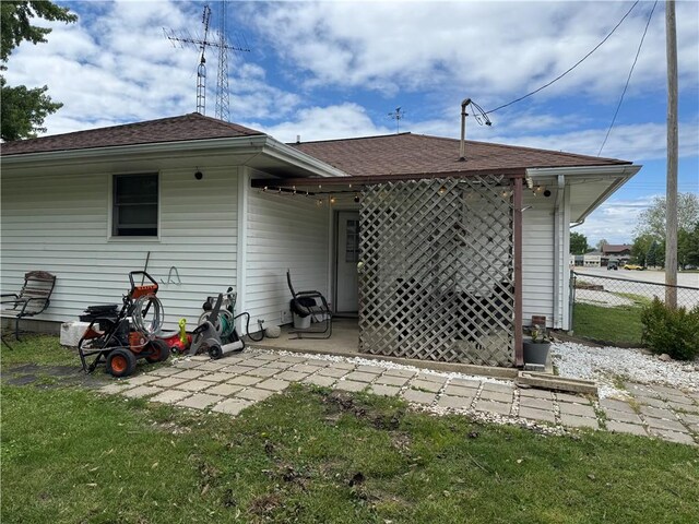 102 W Adams St, Toledo, IL 62468 - rear view of property with a patio area and roof with shingles