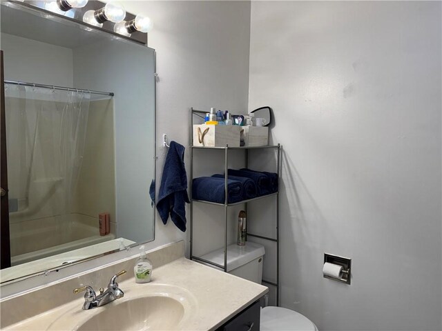 102 W Adams St, Toledo, IL 62468 - full bath with toilet, vanity, and shower / bath combination with curtain