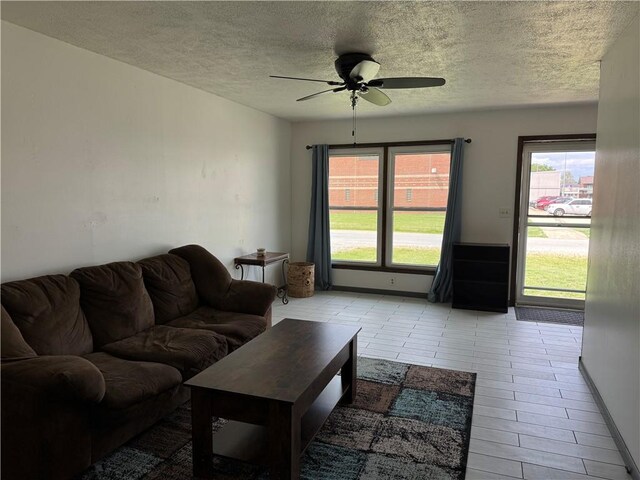 102 W Adams St, Toledo, IL 62468 - living room featuring plenty of natural light, a textured ceiling, and ceiling fan