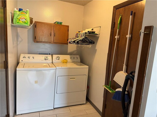 102 W Adams St, Toledo, IL 62468 - washroom featuring cabinet space and washer and clothes dryer