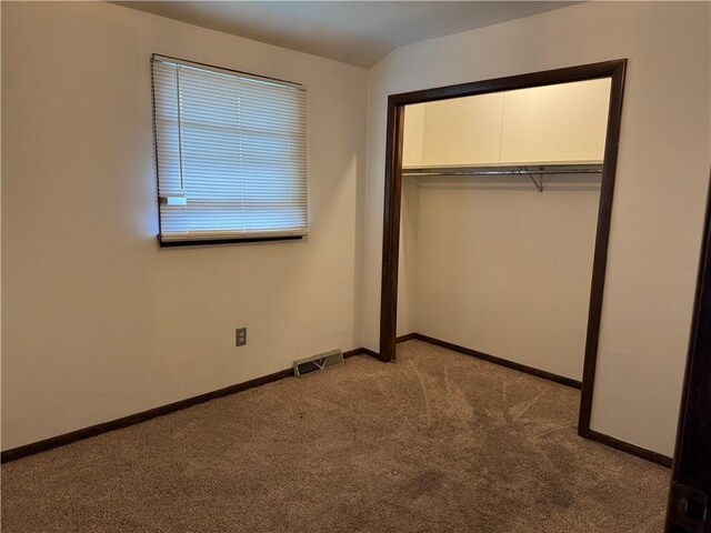 102 W Adams St, Toledo, IL 62468 - unfurnished bedroom featuring carpet, a closet, and baseboards
