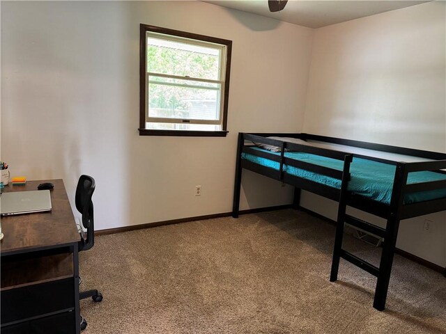 102 W Adams St, Toledo, IL 62468 - unfurnished bedroom with carpet, baseboards, and an office area