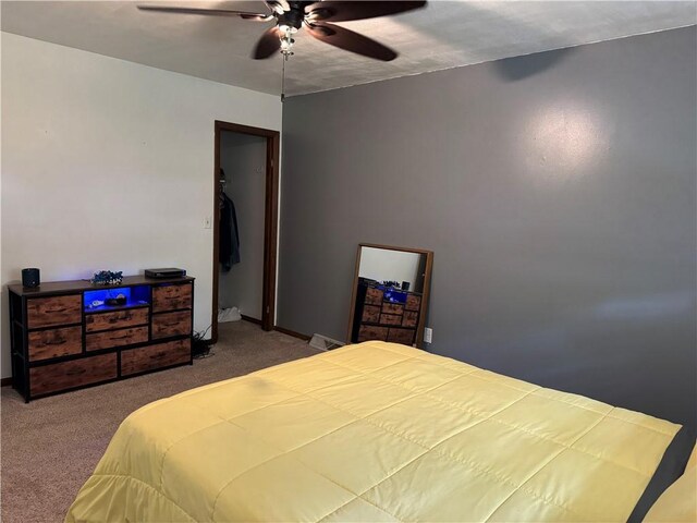102 W Adams St, Toledo, IL 62468 - carpeted bedroom featuring ceiling fan and baseboards