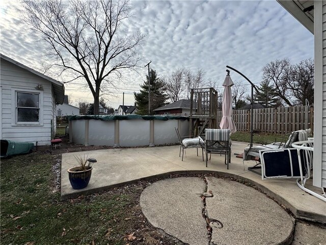 view of patio with a covered pool