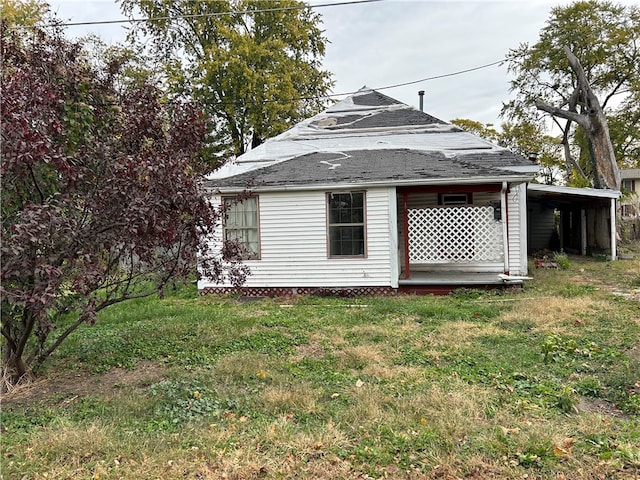 view of outbuilding featuring a carport