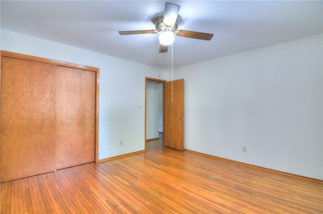 325 S Durfee St, Warrensburg, IL 62573 - unfurnished bedroom with light wood-type flooring, a closet, and ceiling fan