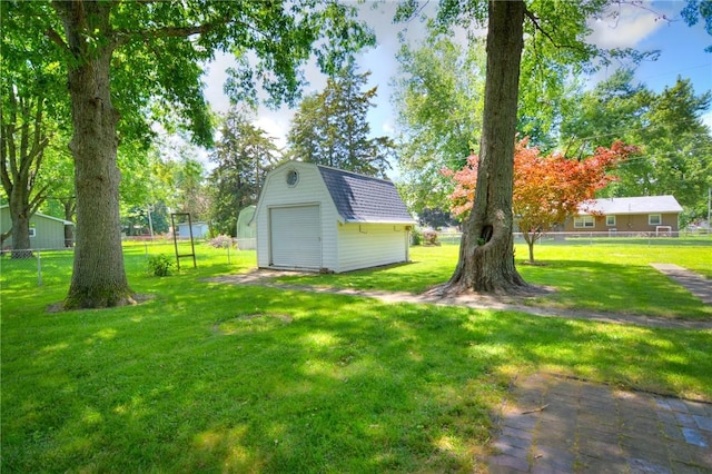 325 S Durfee St, Warrensburg, IL 62573 - view of yard with a garage and a storage unit