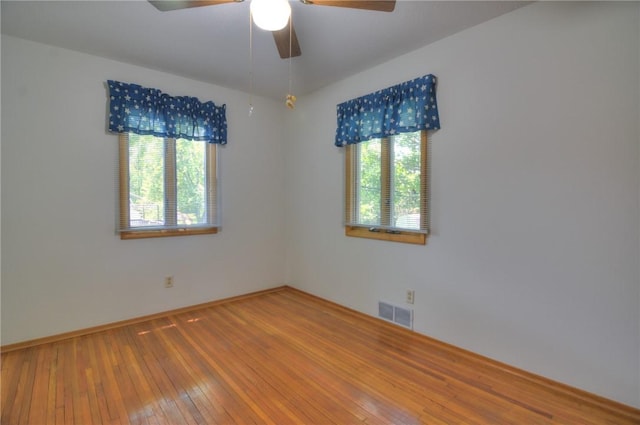325 S Durfee St, Warrensburg, IL 62573 - empty room with a ceiling fan and hardwood / wood-style floors