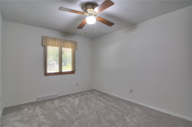 325 S Durfee St, Warrensburg, IL 62573 - spare room featuring carpet floors, a ceiling fan, and a textured ceiling