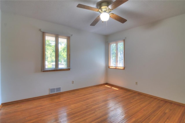 325 S Durfee St, Warrensburg, IL 62573 - unfurnished room with hardwood / wood-style floors and a ceiling fan