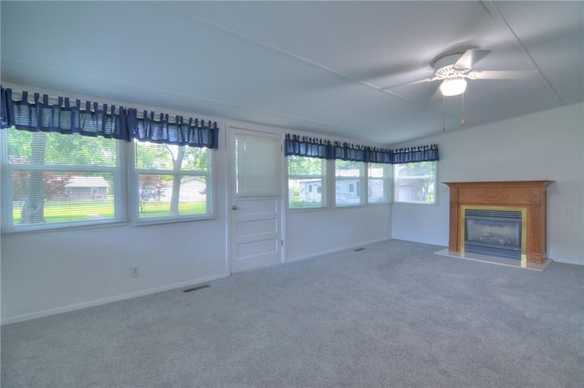325 S Durfee St, Warrensburg, IL 62573 - unfurnished living room with carpet floors, ceiling fan, and a glass covered fireplace