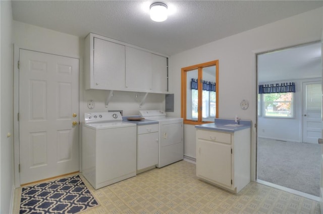 325 S Durfee St, Warrensburg, IL 62573 - laundry room with washing machine and dryer, cabinet space, and a textured ceiling