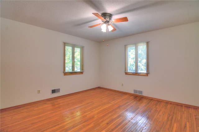 325 S Durfee St, Warrensburg, IL 62573 - spare room with plenty of natural light, ceiling fan, and light wood-style floors