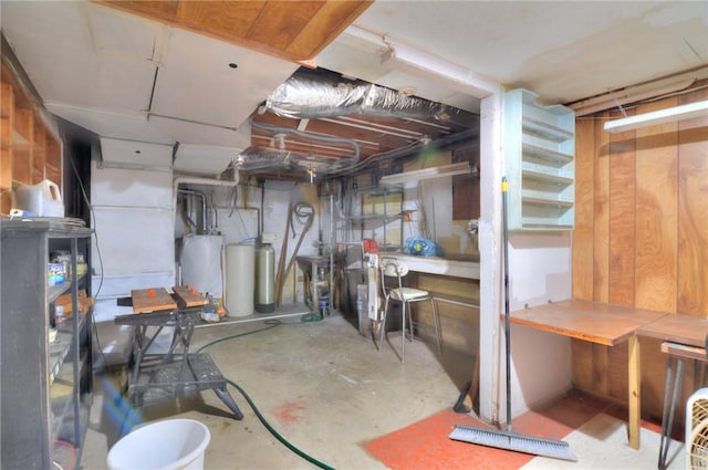 325 S Durfee St, Warrensburg, IL 62573 - unfinished basement with gas water heater, a workshop area, and a water softener system