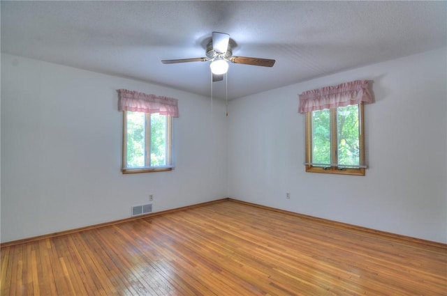 325 S Durfee St, Warrensburg, IL 62573 - unfurnished room featuring wood-type flooring and ceiling fan
