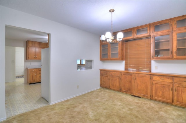 325 S Durfee St, Warrensburg, IL 62573 - unfurnished dining area with a chandelier and light colored carpet