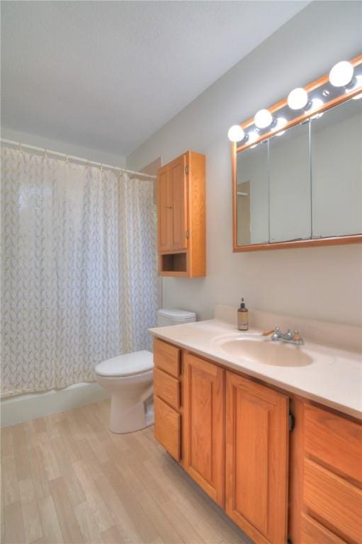325 S Durfee St, Warrensburg, IL 62573 - bathroom with wood finished floors, vanity, and shower / bath combo