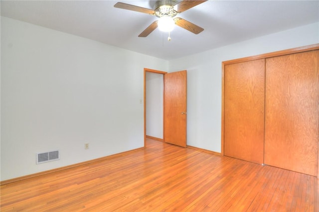 325 S Durfee St, Warrensburg, IL 62573 - unfurnished bedroom with light wood finished floors, a closet, and ceiling fan