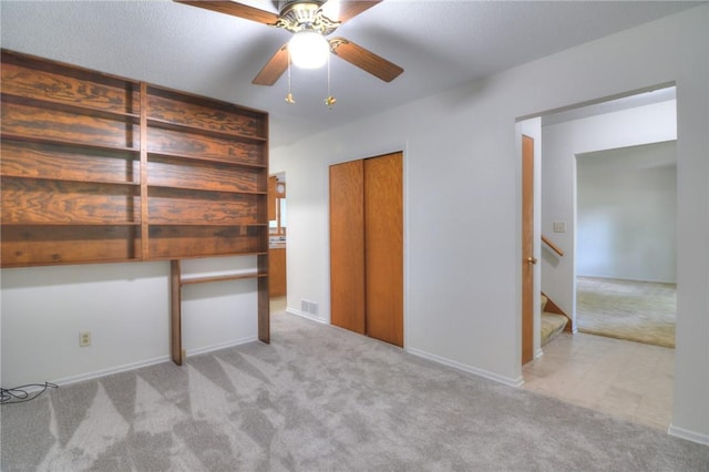325 S Durfee St, Warrensburg, IL 62573 - unfurnished bedroom with carpet floors, ceiling fan, and a closet