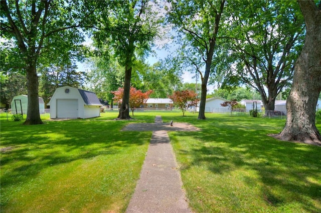 325 S Durfee St, Warrensburg, IL 62573 - view of yard featuring a garage and a storage unit
