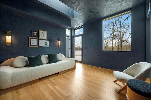 9219 E Best Ct, Effingham, IL 62401 - living area featuring hardwood / wood-style floors and a wall of windows