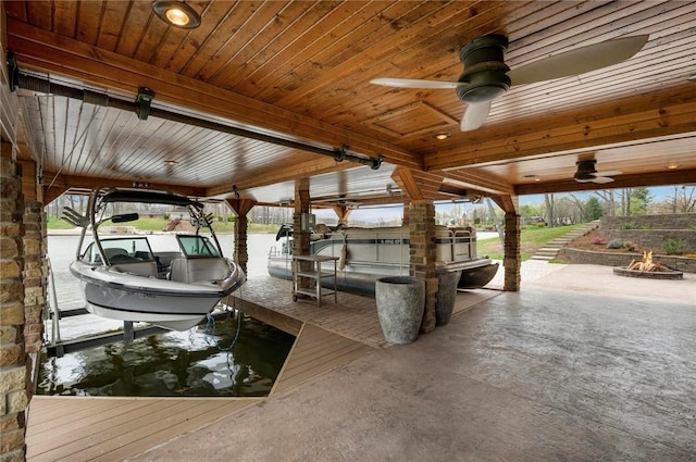 9219 E Best Ct, Effingham, IL 62401 - dock area with boat lift and a fire pit