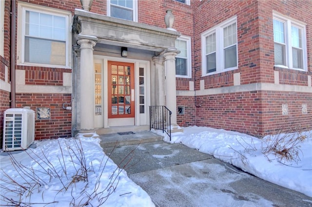 view of snow covered property entrance