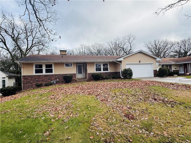 ranch-style house with a garage and a front lawn