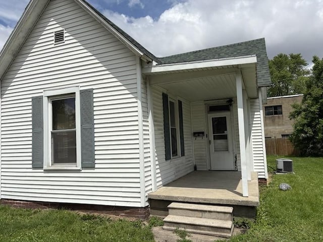 back of house featuring central AC unit