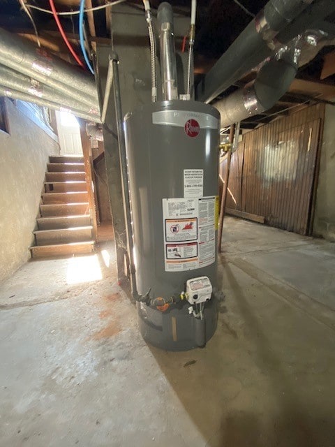 utility room featuring water heater