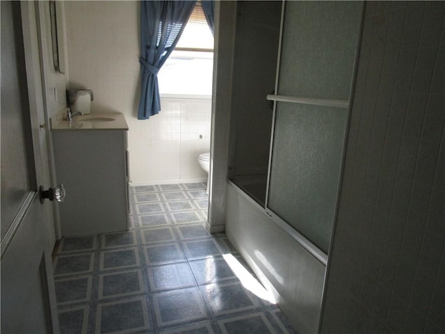 136 Macarthur Blvd, Pana, IL 62557 - full bath featuring vanity and combined bath / shower with glass door