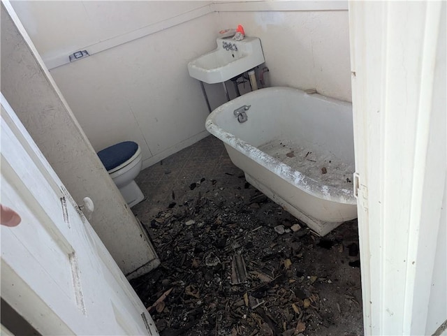 321 N 16th St, Mattoon, IL 61938 - bathroom featuring toilet and a freestanding bath