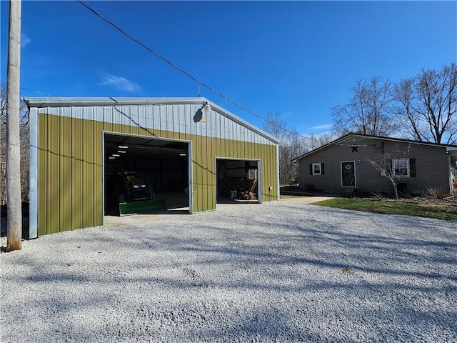 exterior space with gravel driveway