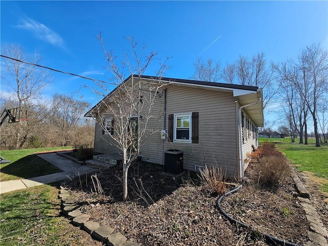 view of property exterior featuring concrete driveway