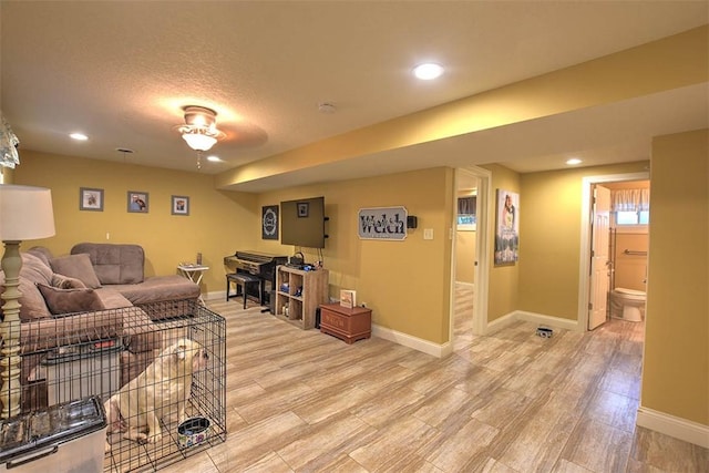 living room with hardwood / wood-style flooring and a textured ceiling