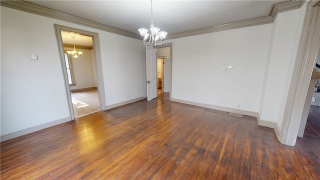 1204 N Franklin St, Danville, IL 61832 - empty room with a chandelier, crown molding, wood finished floors, and baseboards