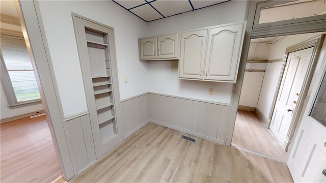 1204 N Franklin St, Danville, IL 61832 - kitchen featuring light wood-style floors, wainscoting, and a paneled ceiling