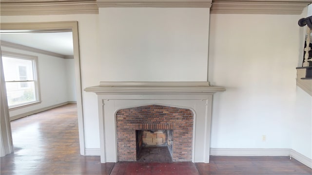 1204 N Franklin St, Danville, IL 61832 - detailed view of a fireplace, crown molding, wood finished floors, and baseboards