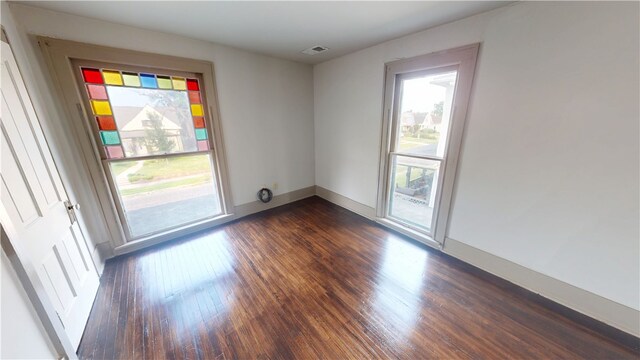 1204 N Franklin St, Danville, IL 61832 - unfurnished room featuring dark wood-style floors and baseboards