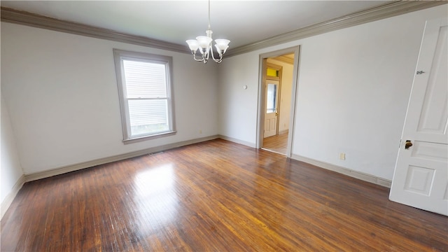 1204 N Franklin St, Danville, IL 61832 - spare room with a chandelier, crown molding, baseboards, and wood finished floors
