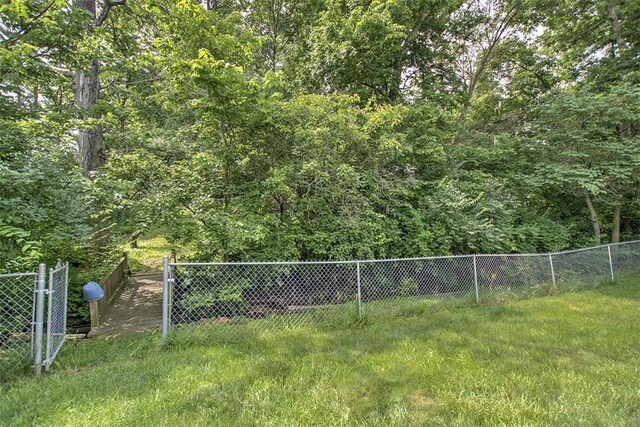 1065 S Wildwood Dr, Mt Zion, IL 62549 - view of yard featuring a forest view