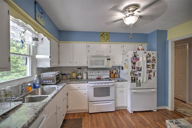 1065 S Wildwood Dr, Mt Zion, IL 62549 - kitchen with white appliances, wood finished floors, ceiling fan, a textured ceiling, and white cabinetry