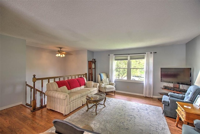 1065 S Wildwood Dr, Mt Zion, IL 62549 - living room with a textured ceiling, wood finished floors, and a ceiling fan