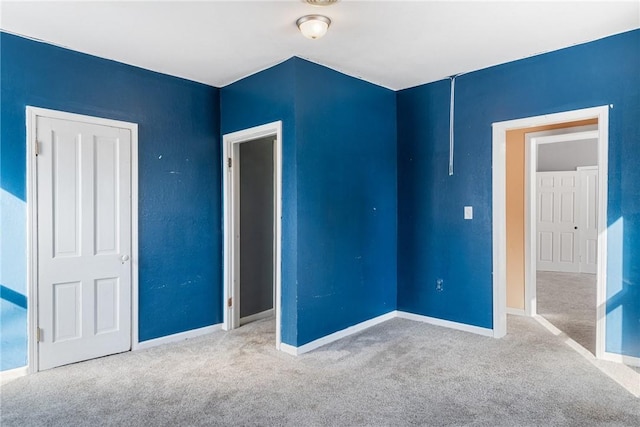 unfurnished bedroom with carpet floors