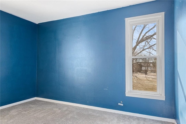 unfurnished room featuring carpet flooring