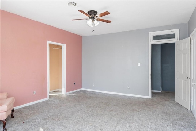 unfurnished bedroom featuring light colored carpet and ceiling fan