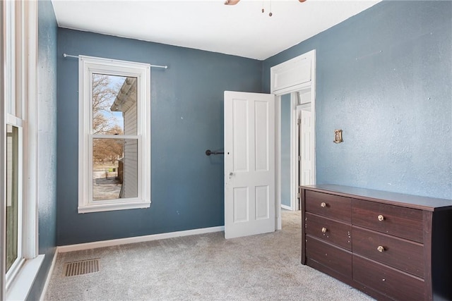 bedroom with light carpet